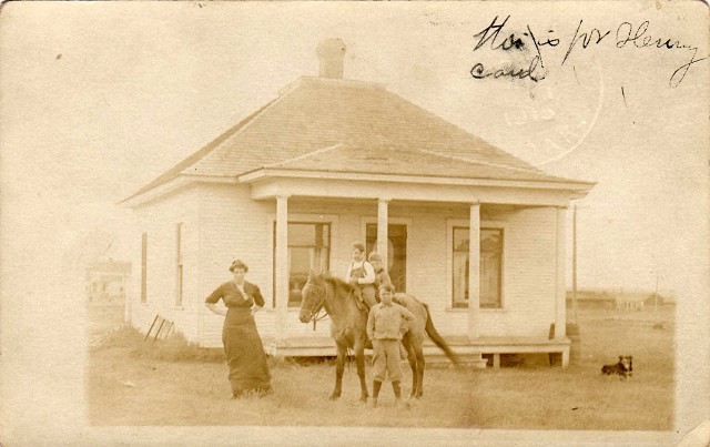 # 23  PC  Thora Roman and her sons, James and Ransom Roman (on horseback), with neighbor boy (standing).